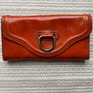 Sofia C vintage orange leather Made in Italy wallet with brass clasp.